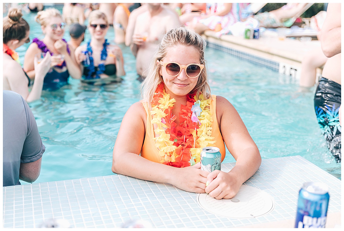 blonde woman in a pool at a party