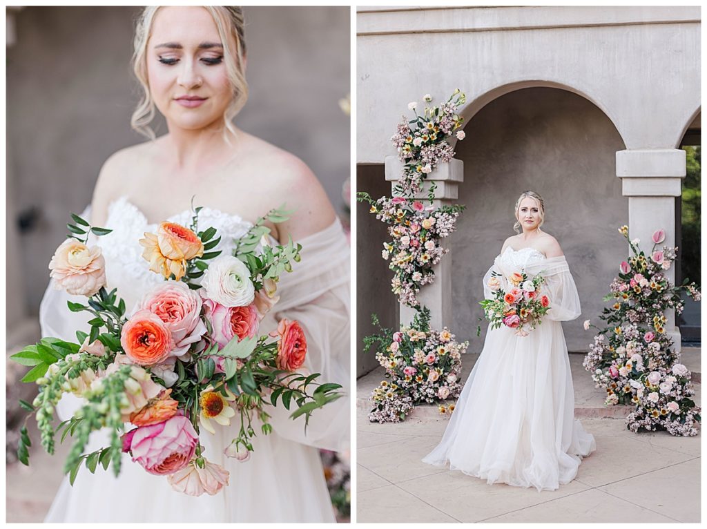 bride holding a bright bouquet in front of a floral arbor